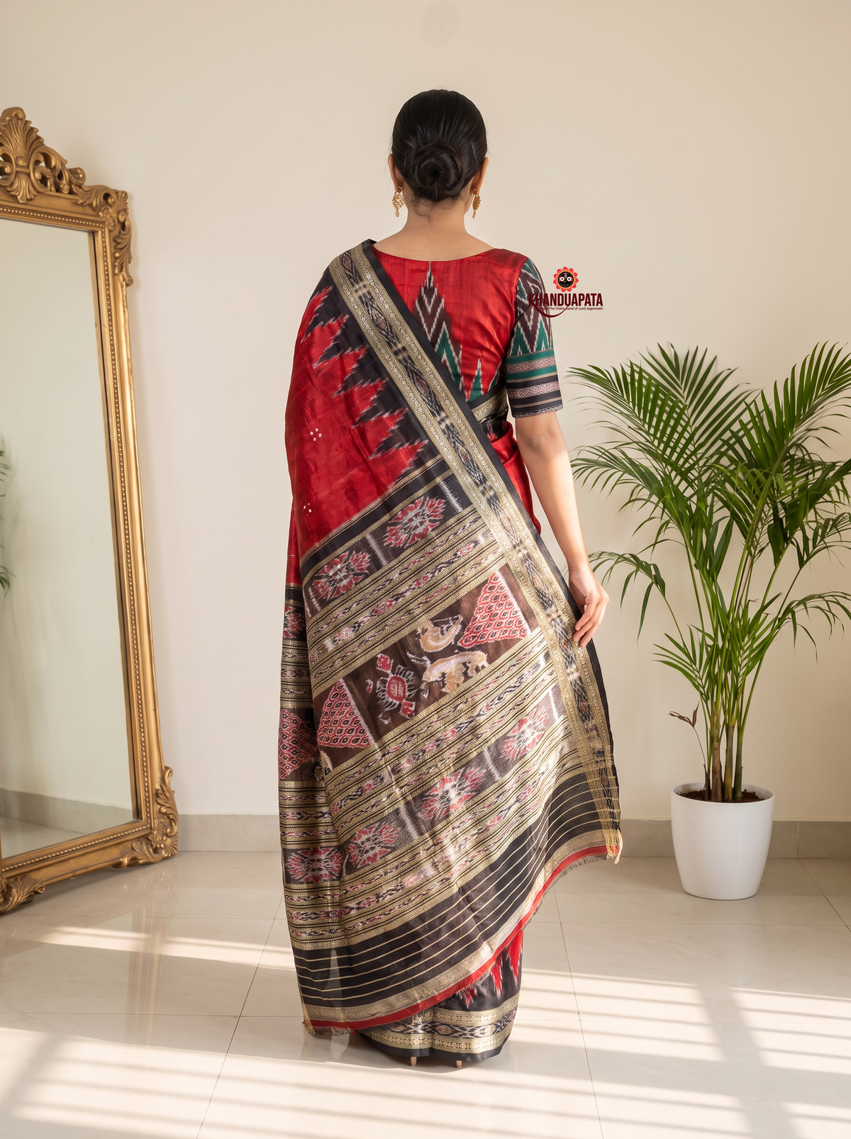 Red and black colour traditional Ikat design silk saree by Khanduapata - styled view