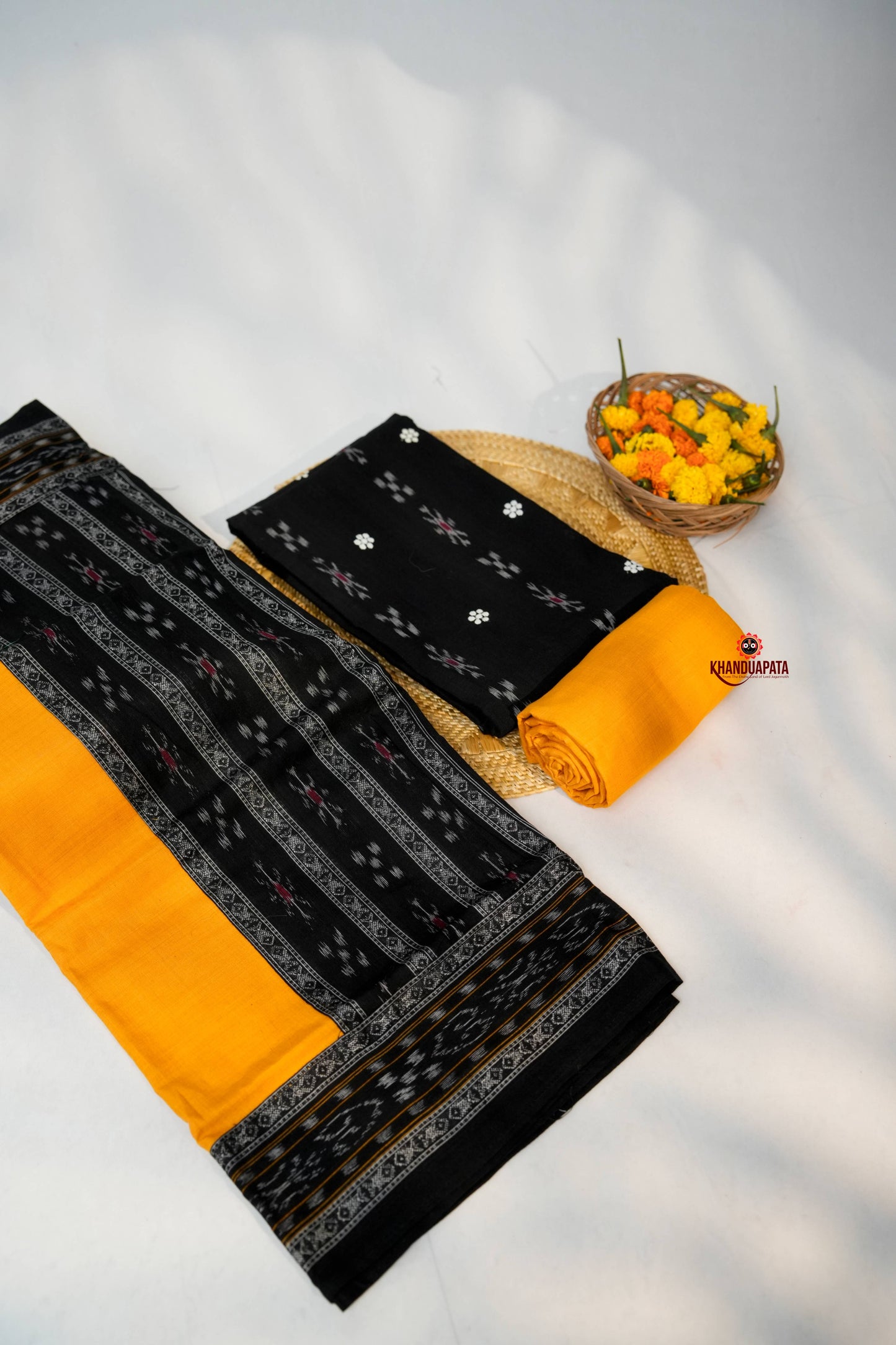 Black and yellow fabric with floral design on a white background