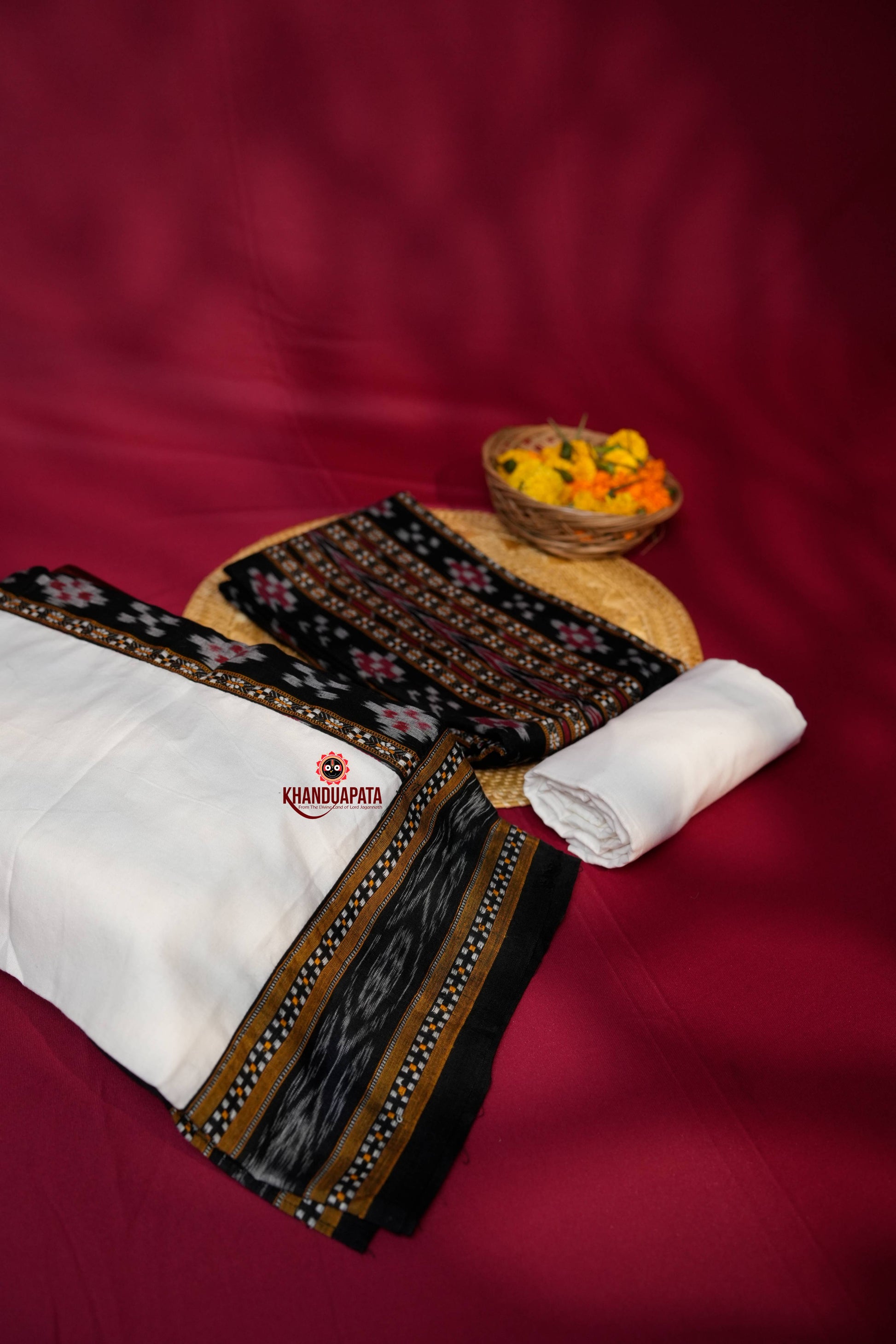 Traditional fabric with intricate patterns on a red background