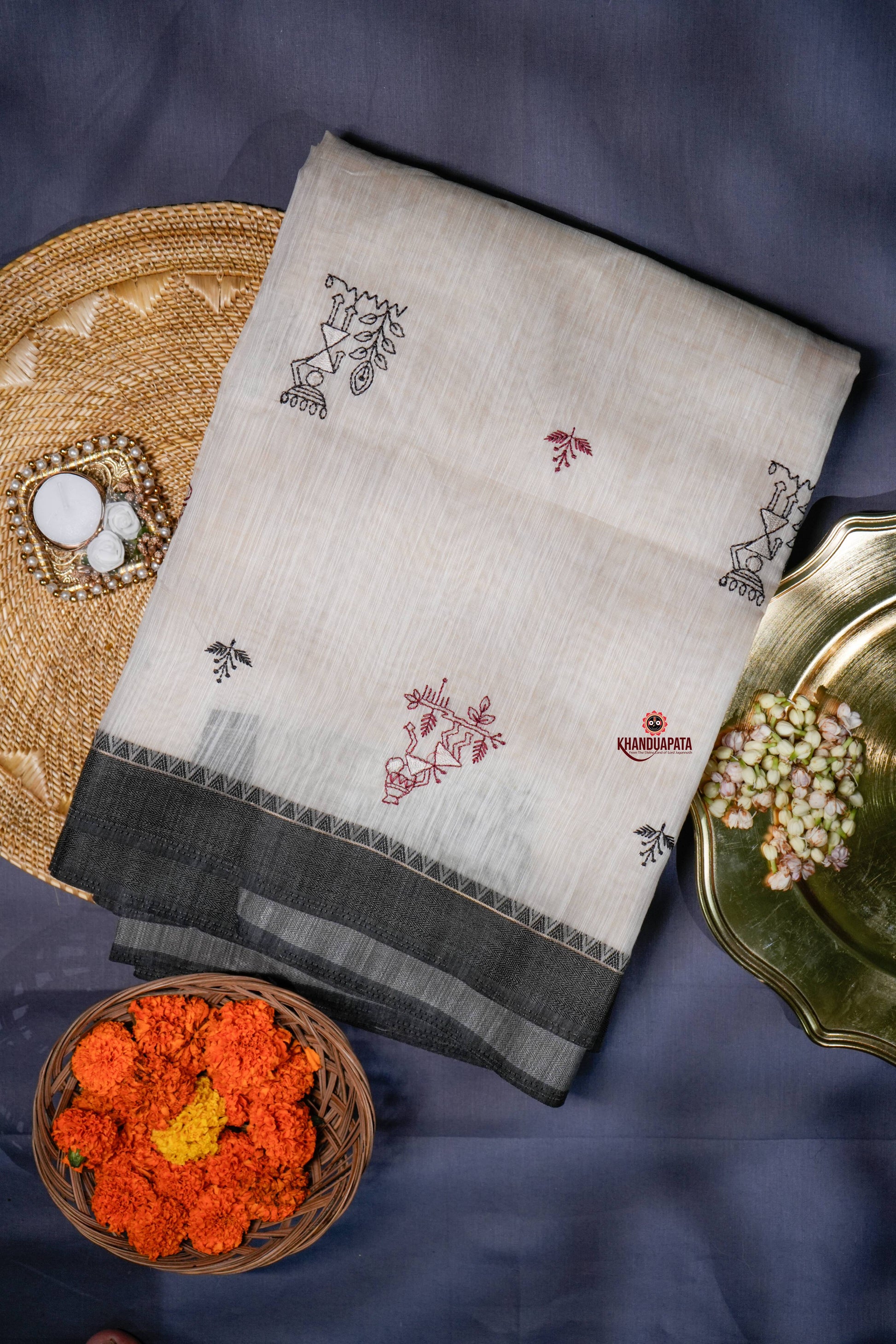 Embroidered fabric with floral patterns on a dark background