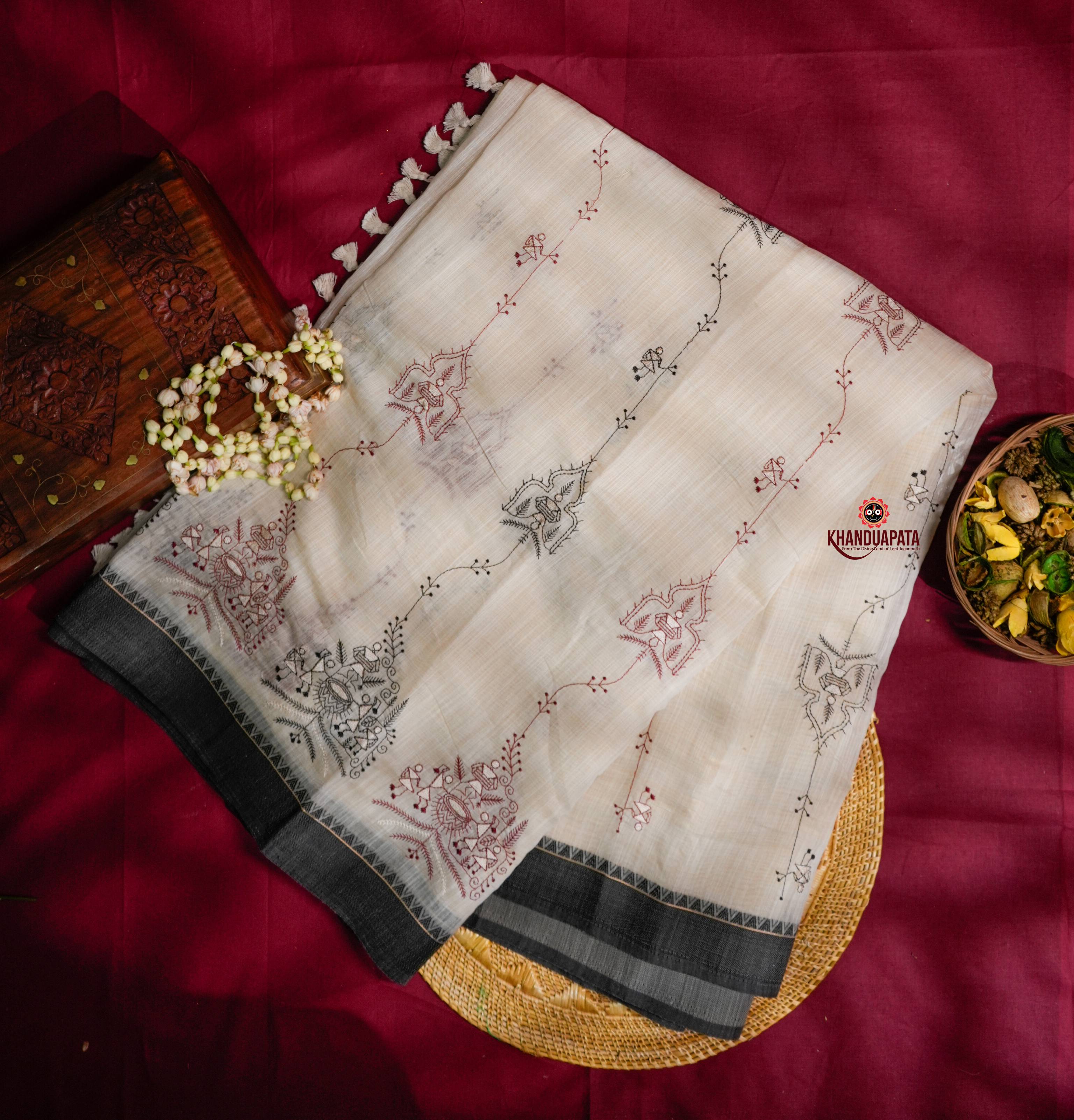 Embroidered fabric with floral patterns on a red background